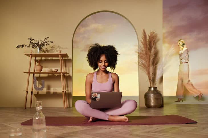 Mindspace flex office offers wellness amenities - woman working and doing yoga